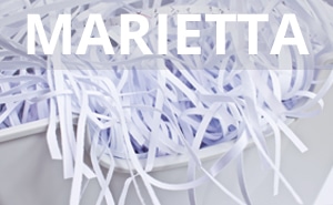 Shredded paper with the word Marietta overlaid on it