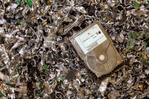 Hard drive on pile of shredded hard drives